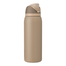 Full profile shot of the 40oz Down to Earth FreeSip water bottle in tan, highlighting its sleek design and sturdy construction.